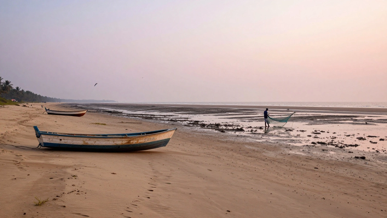 Vast tidal beach with stranded boats and distant fisherman, wide open sand stretching to the horizon at low tide.