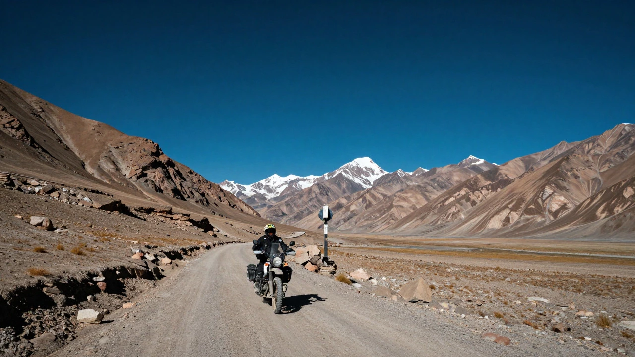 Motorcyclist riding through the barren, mountainous landscape of Leh-Ladakh